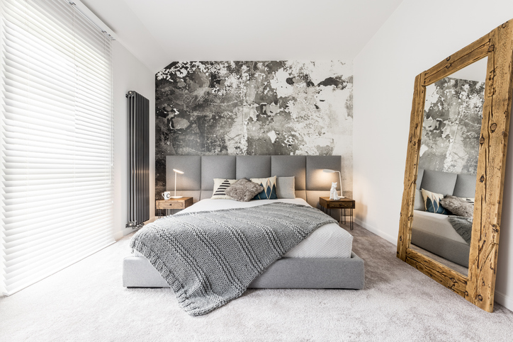 bedroom with large wooden mirror